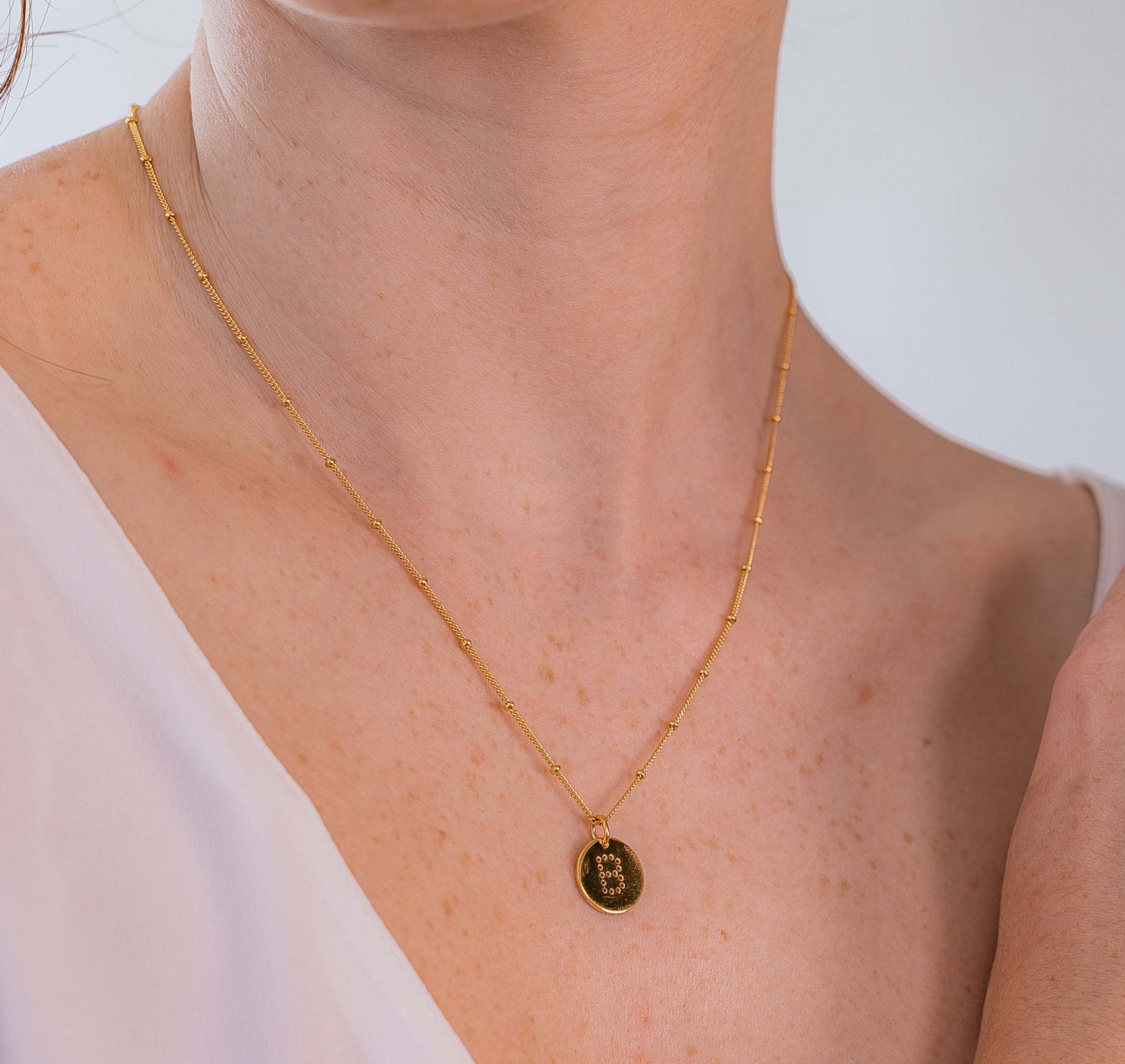 alphabet necklace with letter pendant in 18ct Gold Vermeil on model