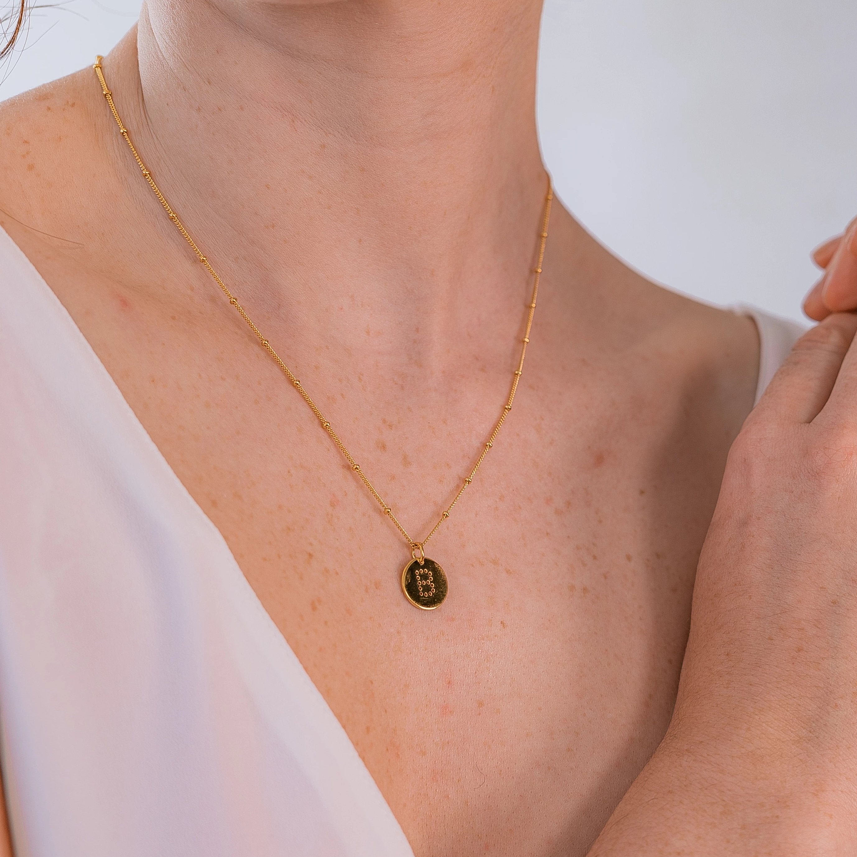 alphabet necklace with letter pendant in 18ct Gold Vermeil on model