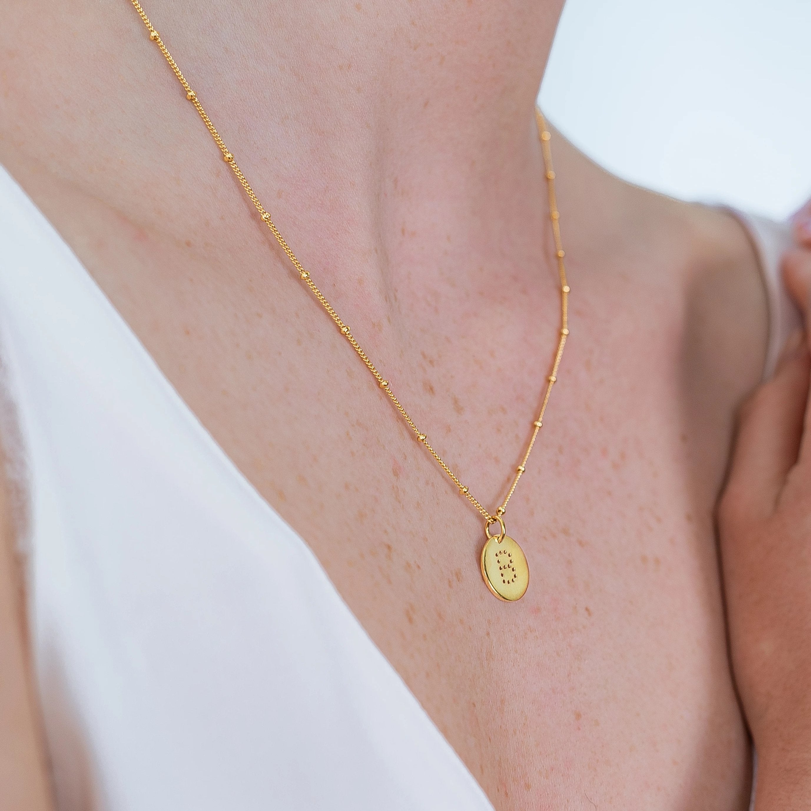 alphabet necklace with letter pendant in 18ct Gold Vermeil on model