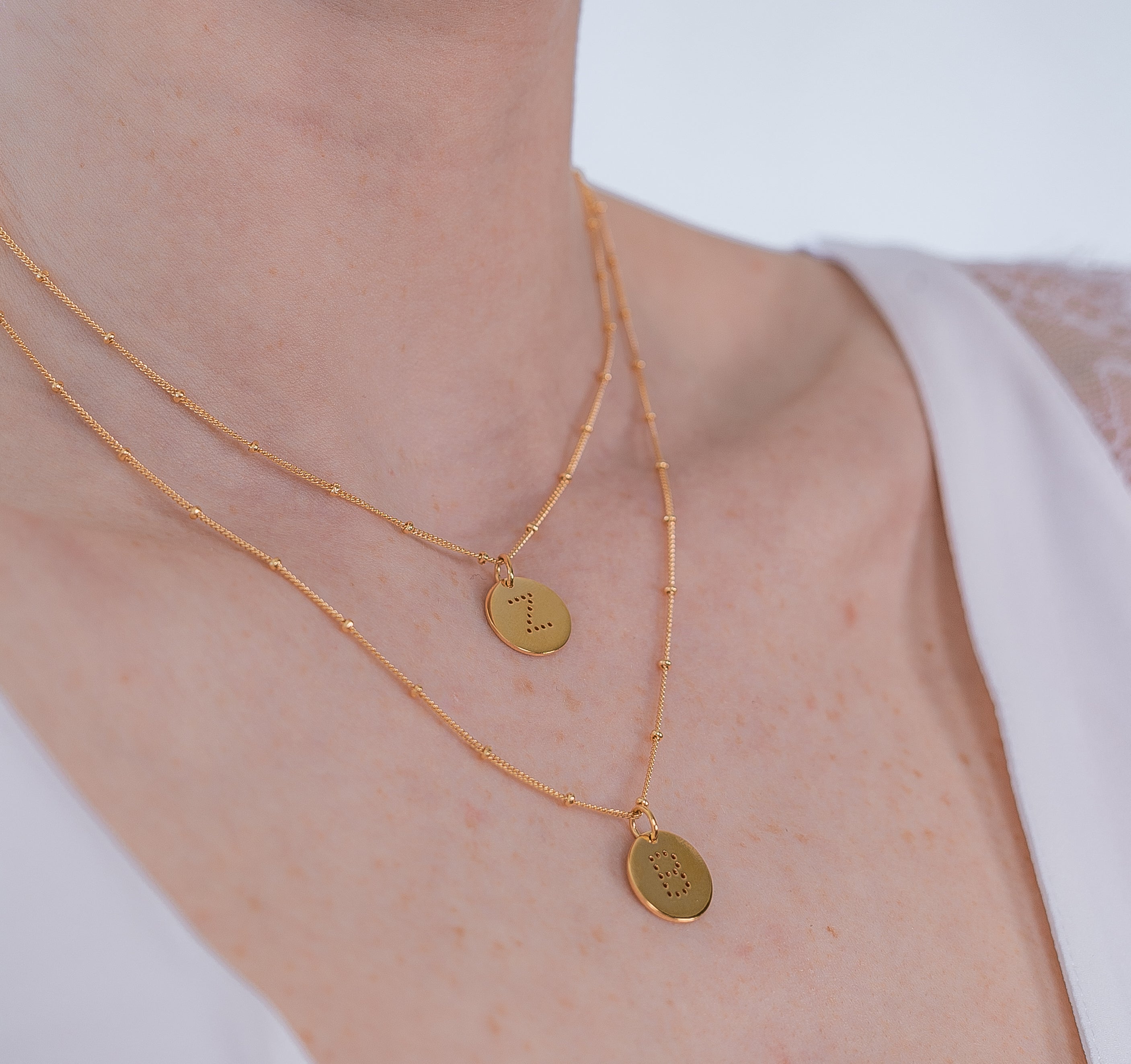 layering alphabet necklaces with letter pendant in 18ct Gold Vermeil on model
