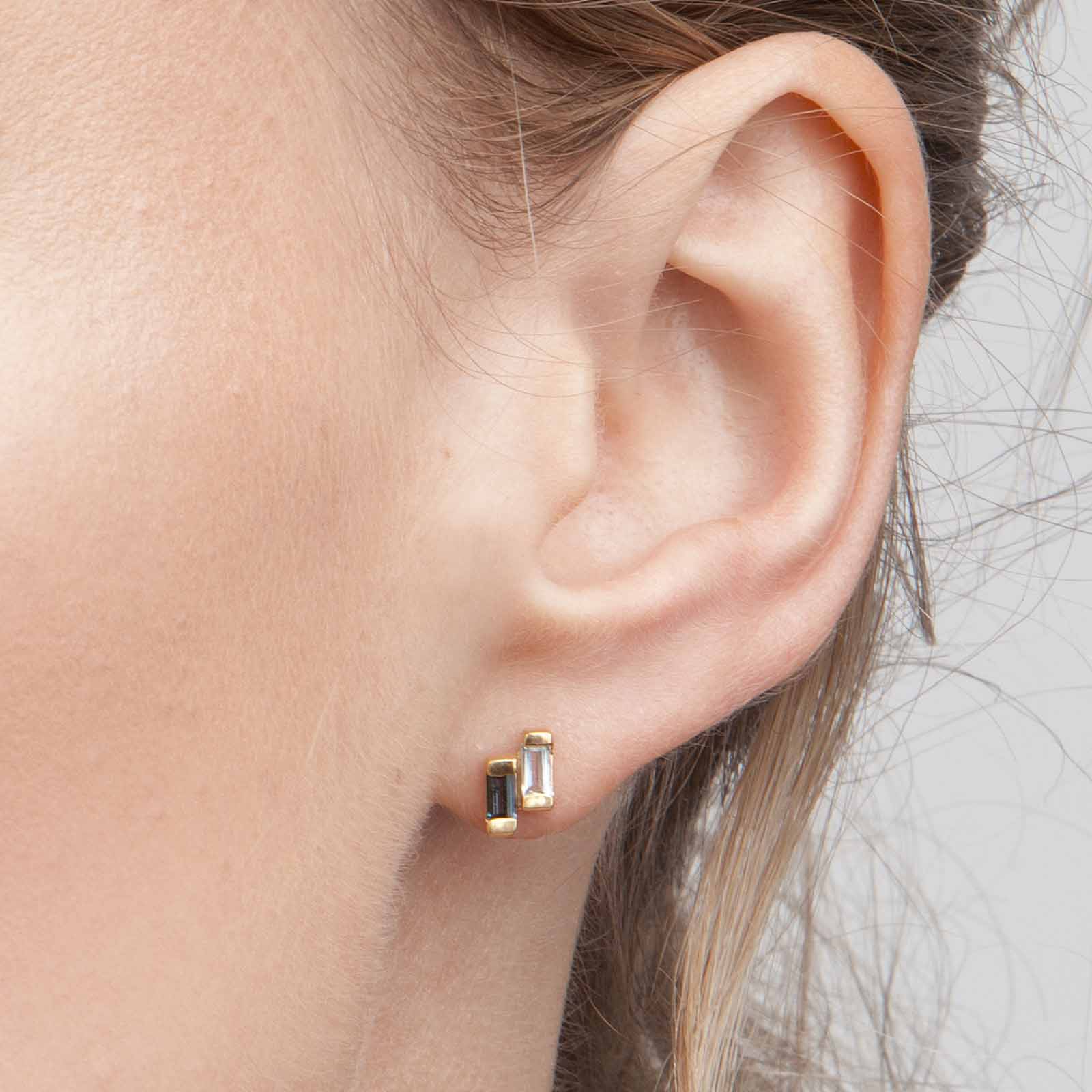 18ct gold vermeil set Anais studs with london and blue topaz on ear view