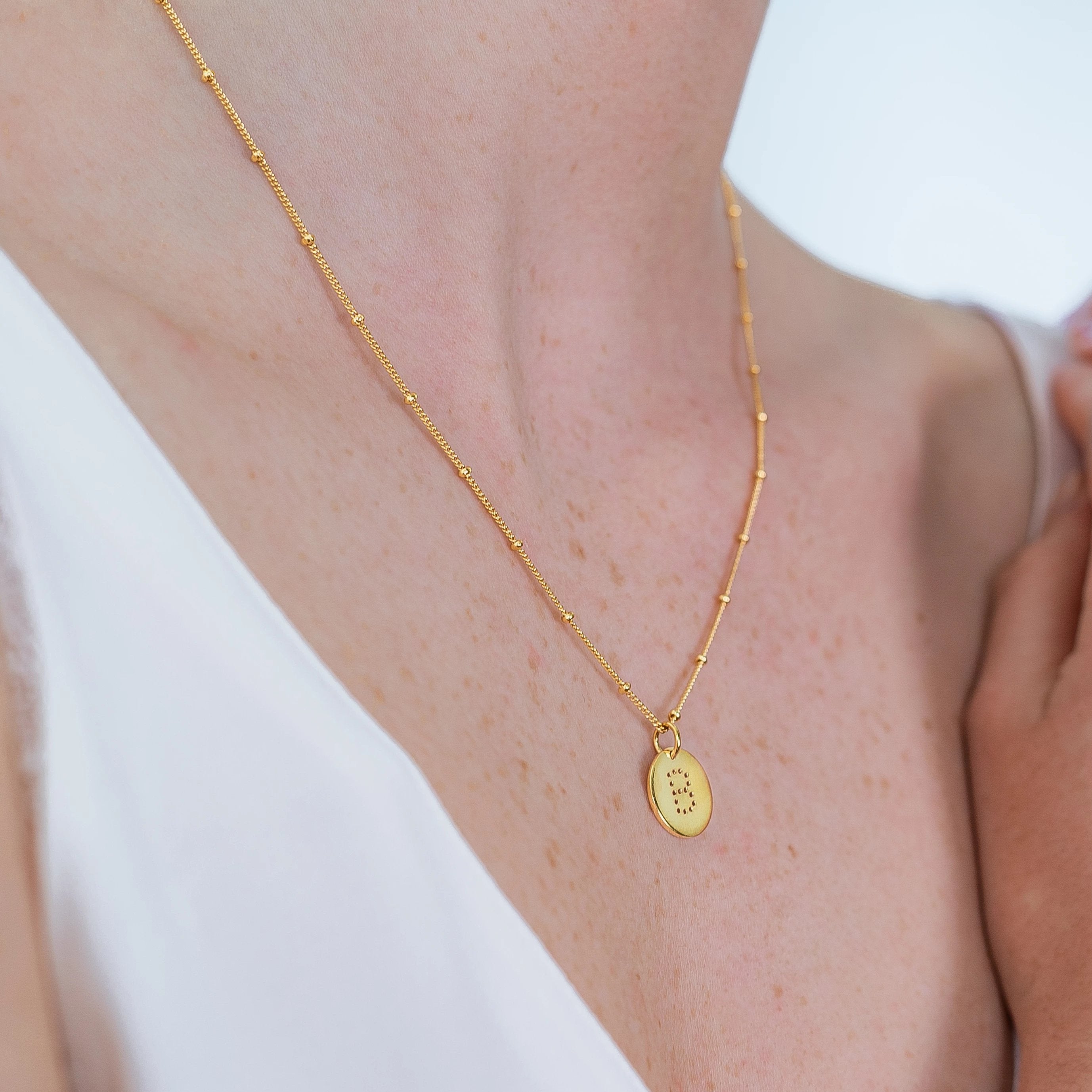 alphabet necklace with letter pendant in 18ct Gold Vermeil on model