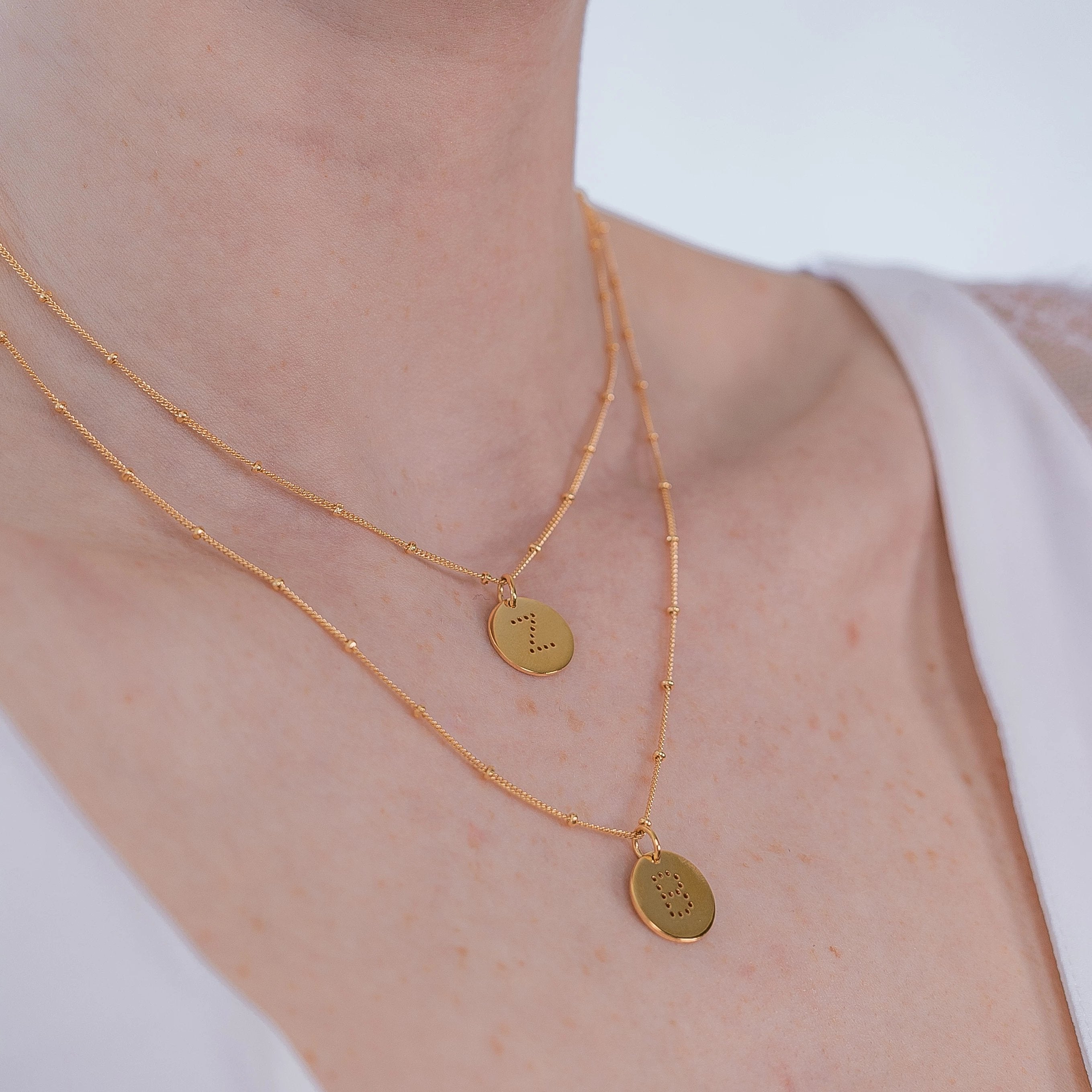 layering alphabet necklaces with letter pendant in 18ct Gold Vermeil on model
